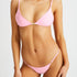 Woman who is tanned in pink bikini